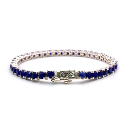 436 - A Round-Cut Blue Sapphire Gemstone Tennis Bracelet set in 925 Silver. 18cm length. 16.8g total weigh... 