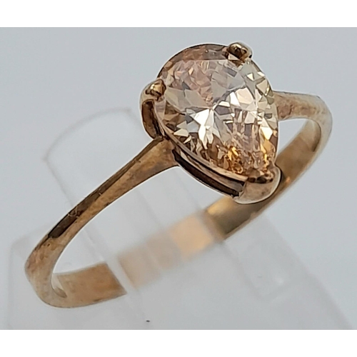 489 - A 9K Yellow Gold CZ Solitaire Ring with tear drop fancy yellow stone. 
Size: O
Weight: 1.88g