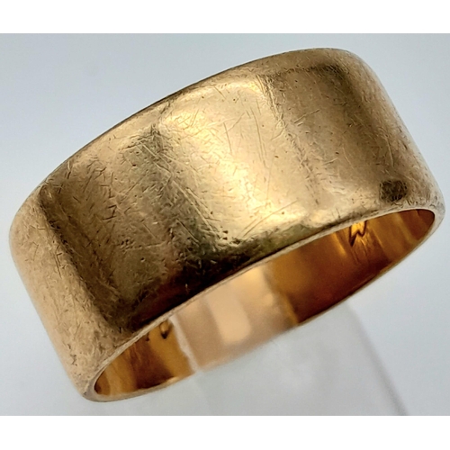 74 - A Vintage 9K Yellow Gold Wide Band Ring. Full UK hallmarks.
Size V/W. 1cm wide. 7.88g