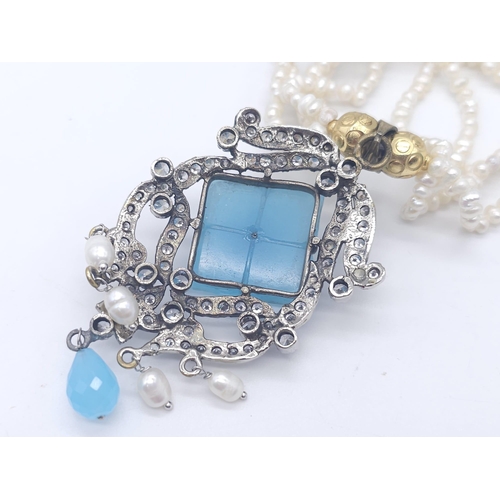 767 - A Vintage Chalcedony and Four Strand Seed Pearl Necklace. With an art deco style drop pendant. Neckl... 