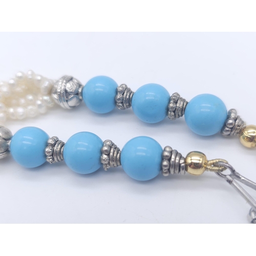 767 - A Vintage Chalcedony and Four Strand Seed Pearl Necklace. With an art deco style drop pendant. Neckl... 