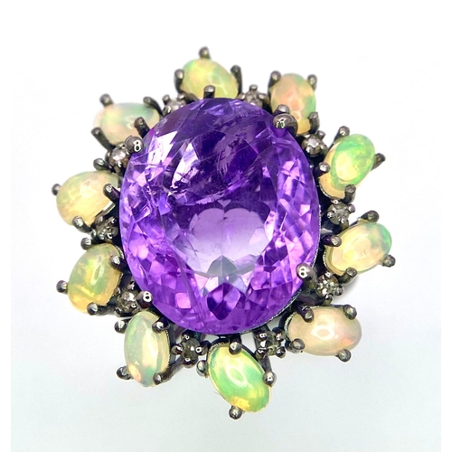 799 - An Amethyst, Opal and Diamond 925 Silver Ring. Central oval amethyst with a diamond and opal halo. D... 