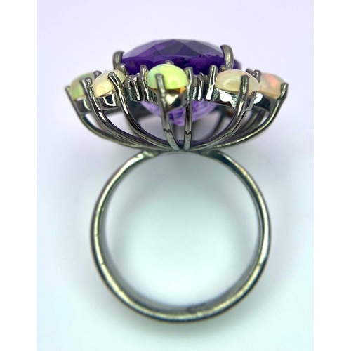 799 - An Amethyst, Opal and Diamond 925 Silver Ring. Central oval amethyst with a diamond and opal halo. D... 