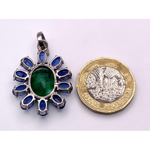 817 - A New-Age Style Emerald and Kyanite Pendant with Diamond accents. Emerald - 8.10ctw. Kyanite - 5.50c... 