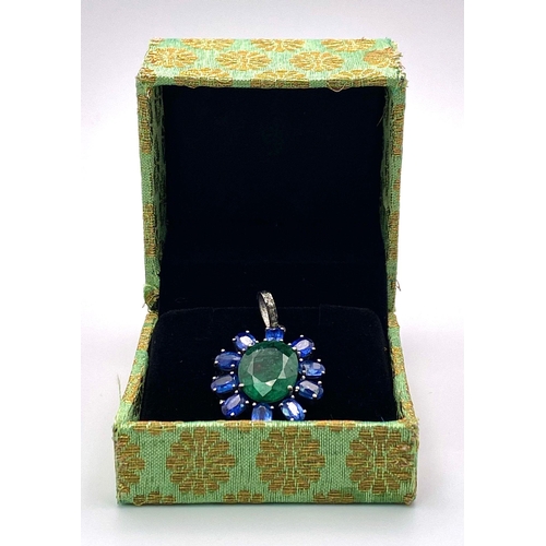 817 - A New-Age Style Emerald and Kyanite Pendant with Diamond accents. Emerald - 8.10ctw. Kyanite - 5.50c... 