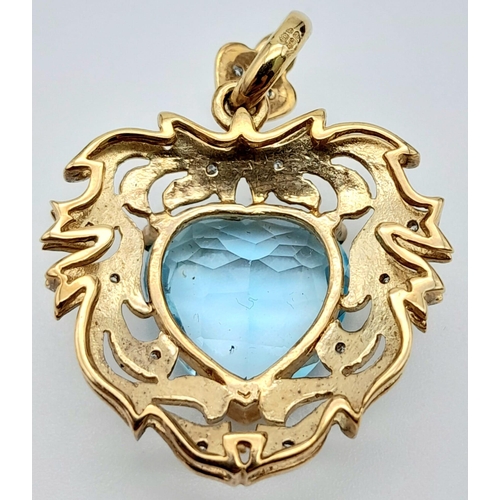 86 - A Sumptuous Antique Style 9K Yellow Gold, Aquamarine and Diamond Pendant. Heart-shape cut aquamarine... 