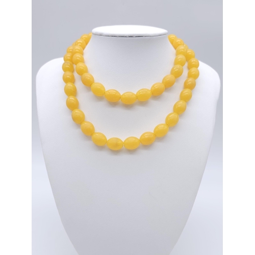 898 - A Vintage Amber Bakelite Bead Necklace and Earring Set. Necklace - 70cm. 3cm earring drop.