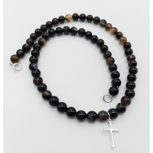 1709 - An Agate Necklace with a 925 Silver Cross Pendant. 2cm and 39cm. 20.20g total weight.