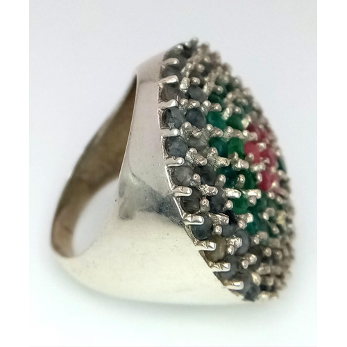 1528 - An Emerald and Sapphire Cocktail Ring with a Ruby Bullseye! Set in 925 Silver. Size Q. 13.9g total w... 