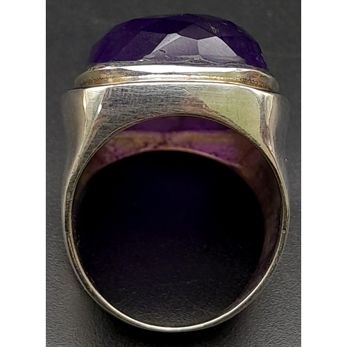 1739 - A Large Faceted Amethyst Gemstone Ring set in 925 Silver. Size Q. 19.1g total weight.