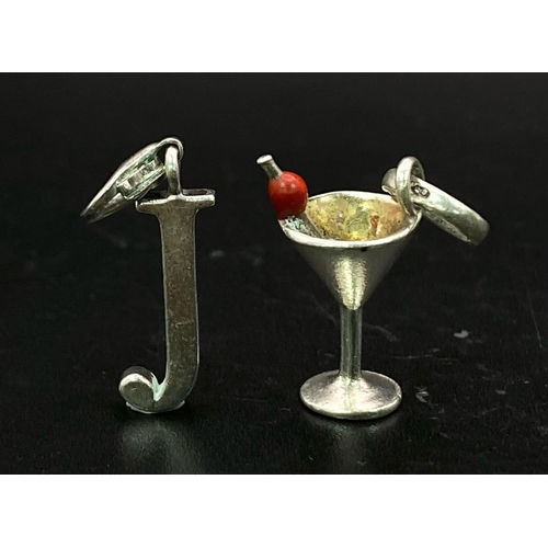 1753 - Two Sterling Silver Charm/Pendants.
Featuring a Martini Glass and an initial 'J'.
Weight: 4.1g