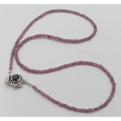 1760 - A Single Strand Pink Sapphire Necklace with Ruby and 925 Silver Clasp. 42cm length.