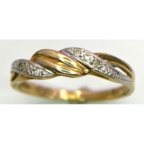 1640 - A Vintage 9k Yellow Gold and Diamond Twist Ring. Size O. 1.52g total weight.