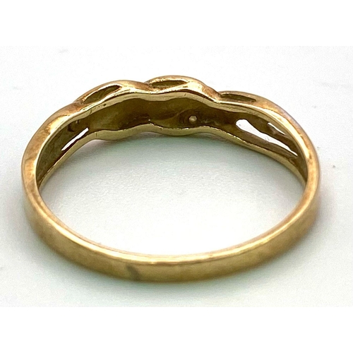 1640 - A Vintage 9k Yellow Gold and Diamond Twist Ring. Size O. 1.52g total weight.