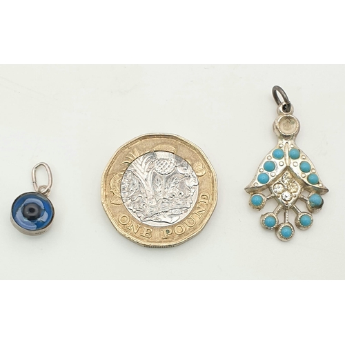 1467 - A set of 2 Pendants: 1 Evil Eyes pendant set in 925 sterling silver and a turquoise silver pendant.
... 