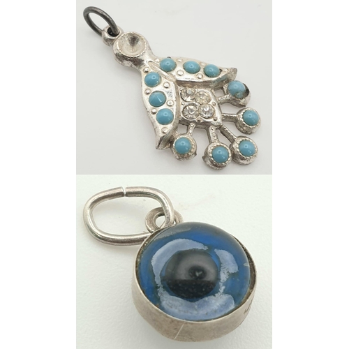 1467 - A set of 2 Pendants: 1 Evil Eyes pendant set in 925 sterling silver and a turquoise silver pendant.
... 