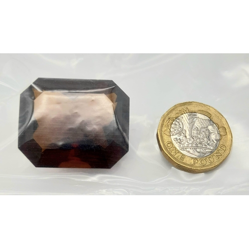 1077 - A 115ct Rich Madeira Citrine Emerald-Cut Gemstone. Eye-Clean and AIG Milan Certified.