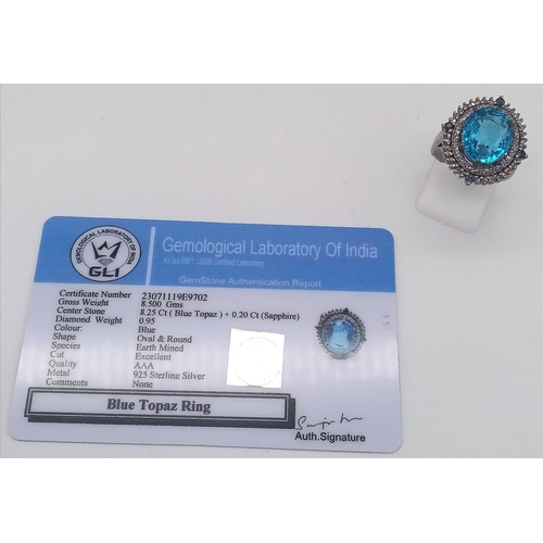 1384 - A 8.25ct Blue Topaz Ring with 0.95ct Diamond Accents and 0.20ct Blue Sapphire Accents on 925 Silver.... 