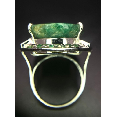 1123 - An Oval Slice Natural Emerald 925 Silver Ring with Emerald Accents. 20ct Emerald. Size Q. 14.88g tot... 