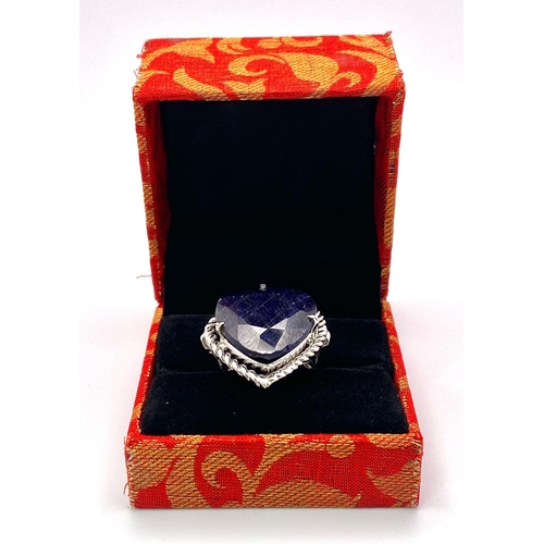 1147 - A Faceted Blue Heart-Shape Sapphire 925 Silver Ring. 6.5ct Sapphire. Size P. 18.6g total weight. Com... 