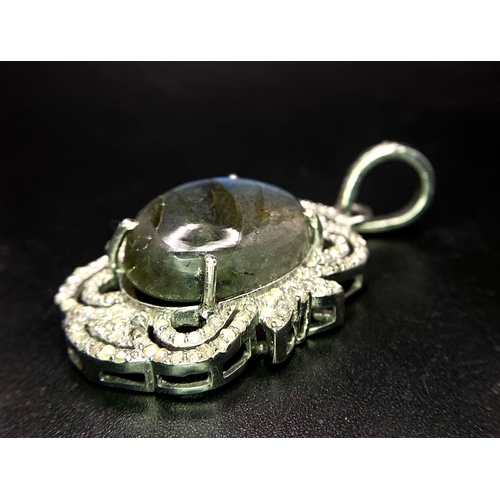 1236 - A Labradorite and Diamond 925 Silver Pendant. 11.3ct colour-change labradorite with an art deco styl... 