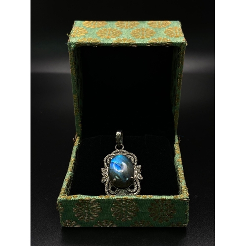 1236 - A Labradorite and Diamond 925 Silver Pendant. 11.3ct colour-change labradorite with an art deco styl... 