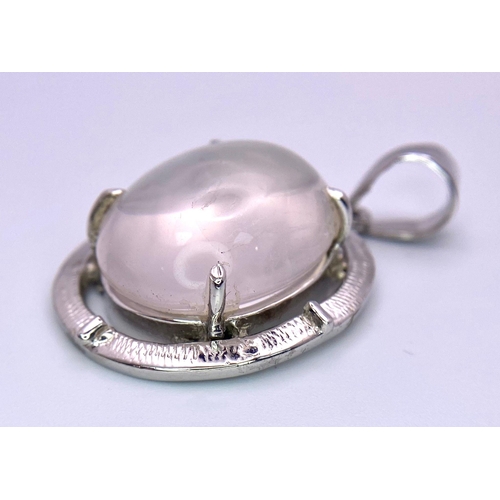 1313 - A Rose Quartz Cabochon 925 Silver Pendant. 4.5cm. 14.2g total weight. Comes with a presentation case... 