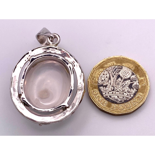 1313 - A Rose Quartz Cabochon 925 Silver Pendant. 4.5cm. 14.2g total weight. Comes with a presentation case... 