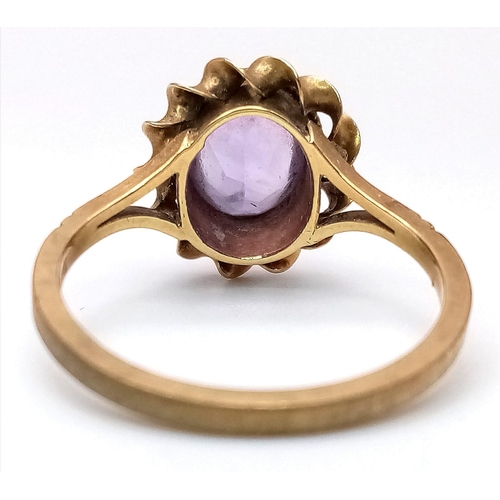 450 - A Vintage 9K Yellow Gold Amethyst Ring. Central oval amethyst in a twist setting. Size P. 2.75g weig... 