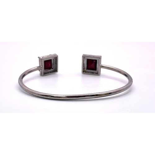 607 - A Step Cut Ruby and Diamond Surround 925 Silver Cuff Bracelet. Rubies - 16.95ctw. Diamonds - 0.50ctw... 