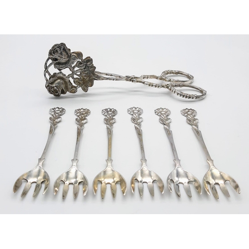 701 - Parcel of antique silver cutlery.
Featuring six ornately handled forks and large servicing tongs (16... 