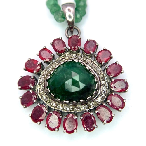 961 - An Emerald Small Rondelle Bead Necklace with an Emerald, Ruby and Diamond Eye-Shape Pendant. Emerald... 