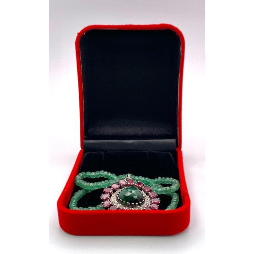 961 - An Emerald Small Rondelle Bead Necklace with an Emerald, Ruby and Diamond Eye-Shape Pendant. Emerald... 