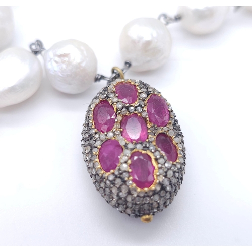 382 - A Baroque Pearl Necklace with an Antique Style Ruby Bead and Pave Set Diamond Drop Pendant. Set in 9... 