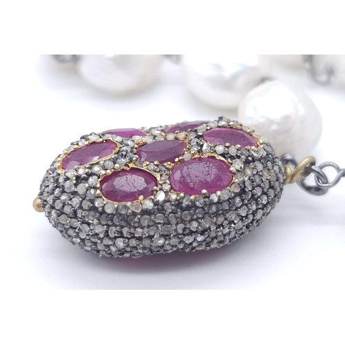 382 - A Baroque Pearl Necklace with an Antique Style Ruby Bead and Pave Set Diamond Drop Pendant. Set in 9... 