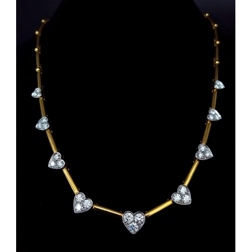 120 - A Gorgeous 18K Gold and Heart-Diamond Necklace and Bracelet Set. The necklace is decorated with grad... 