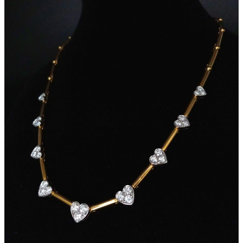 120 - A Gorgeous 18K Gold and Heart-Diamond Necklace and Bracelet Set. The necklace is decorated with grad... 