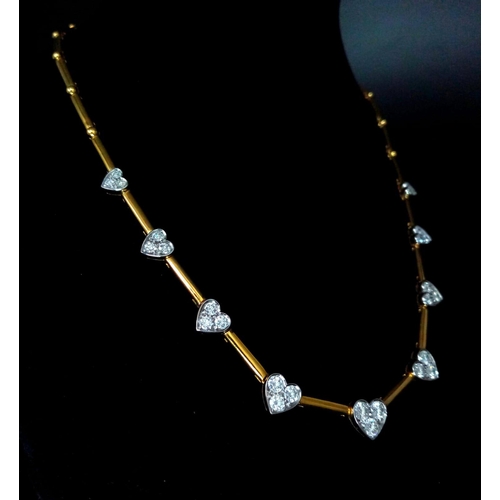 120 - A Gorgeous 18K Gold and Heart-Diamond Necklace and Bracelet Set. The necklace is decorated with grad... 