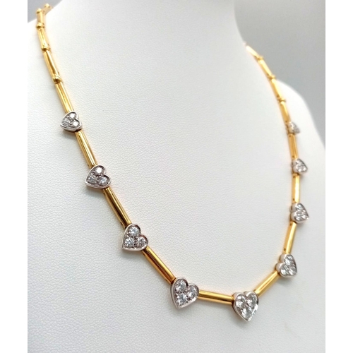 120 - A Gorgeous 18K Gold and Heart-Diamond Necklace and Bracelet Set. The necklace is decorated with grad... 