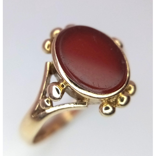 1015 - A Vintage 9K Yellow Carnelian Signet Ring. Size K. 1.94g total weight.