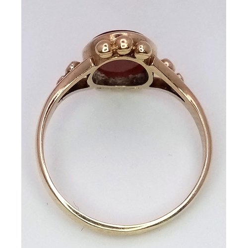 1015 - A Vintage 9K Yellow Carnelian Signet Ring. Size K. 1.94g total weight.