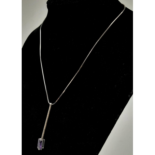 1091 - A modern 925 silver necklace with hanging pendant featuring an amethyst baguette gemstone. Pendant l... 