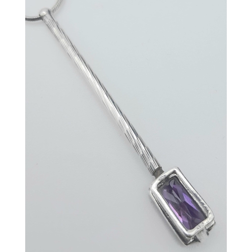 1091 - A modern 925 silver necklace with hanging pendant featuring an amethyst baguette gemstone. Pendant l... 