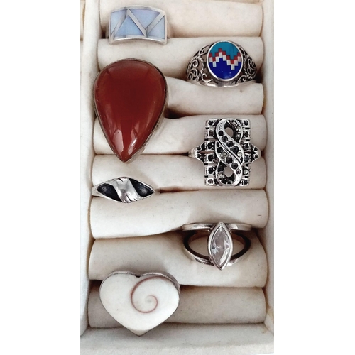 1099 - 20 Silver Rings in display box.
A great variety of sizes and designs.
Total Silver Stamped Weight: 1... 