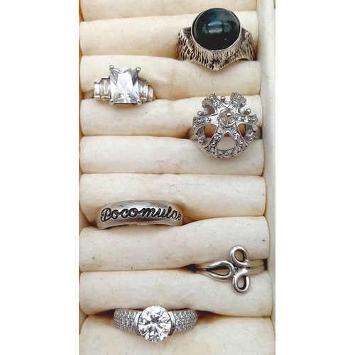 1099 - 20 Silver Rings in display box.
A great variety of sizes and designs.
Total Silver Stamped Weight: 1... 