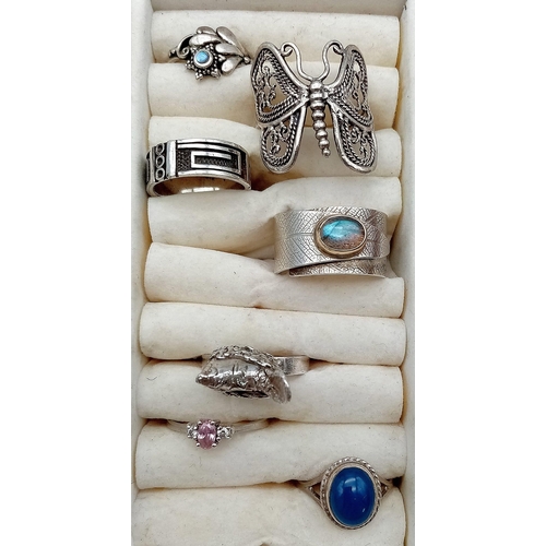 1099 - 20 Silver Rings in display box.
A great variety of sizes and designs.
Total Silver Stamped Weight: 1... 