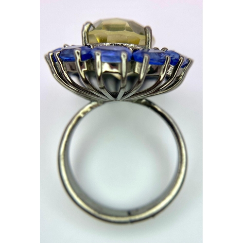 1157 - A Citrine, Kyanite and Diamond 925 Silver Ring. Central oval citrine with diamond and kyanite halos.... 