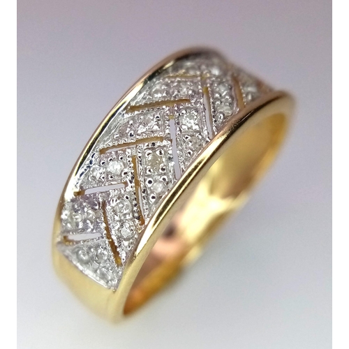 1214 - A 14K Yellow Gold and Diamond Chevron Effect Ring. Size P.
3.48g total weight.