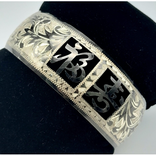 147 - A rare, vintage, sterling silver bangle and matching earrings set with Chinese characters. Total wei... 