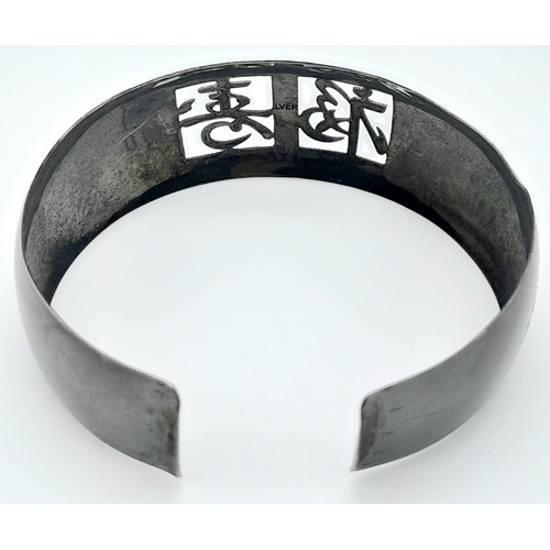 147 - A rare, vintage, sterling silver bangle and matching earrings set with Chinese characters. Total wei... 